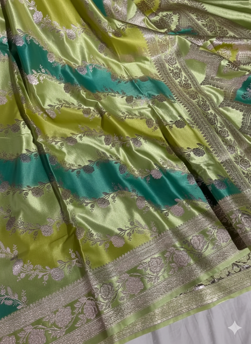 Green fabric with intricate patterns and designs