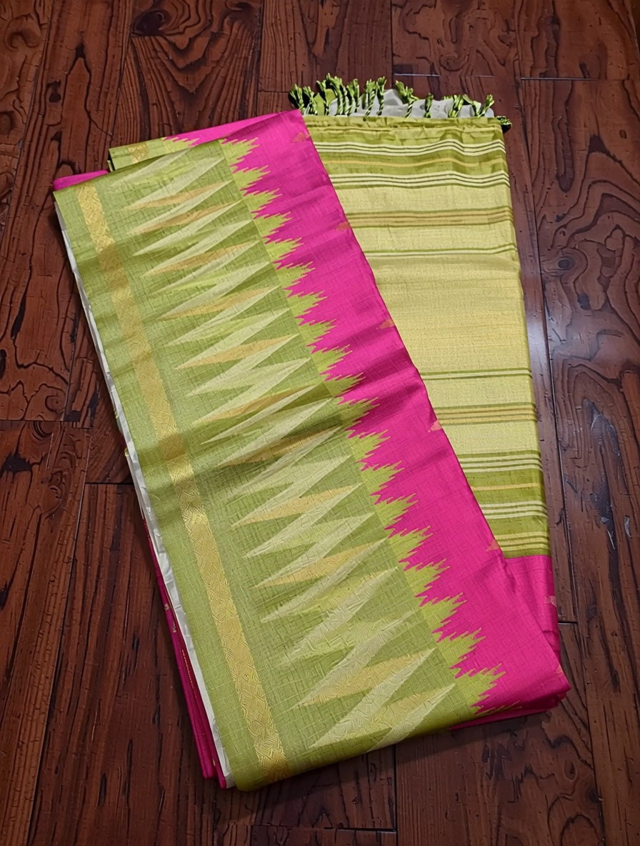 Saree with pink and green pattern on a wooden floor
