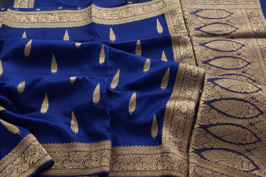 Blue fabric with gold embroidery and patterns