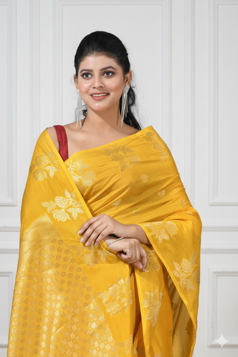 Woman wearing a yellow saree with a white background