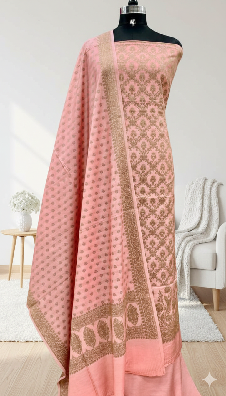 Pink embroidered fabric on a mannequin against a neutral background