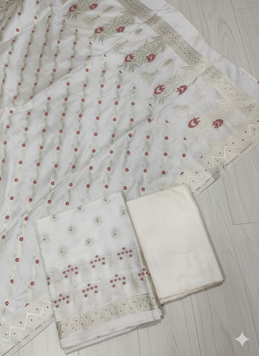 White fabric with red floral patterns on a light wooden floor
