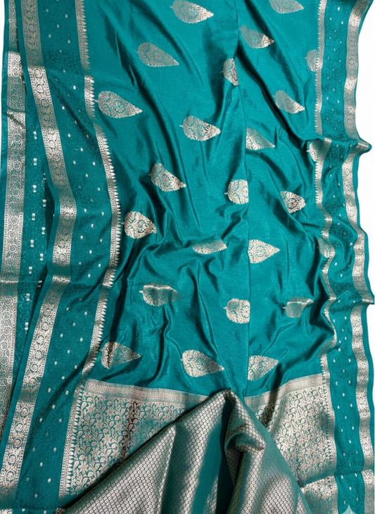 Teal fabric with silver patterns and border