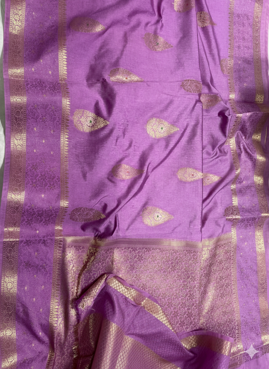 Purple fabric with gold patterns and border