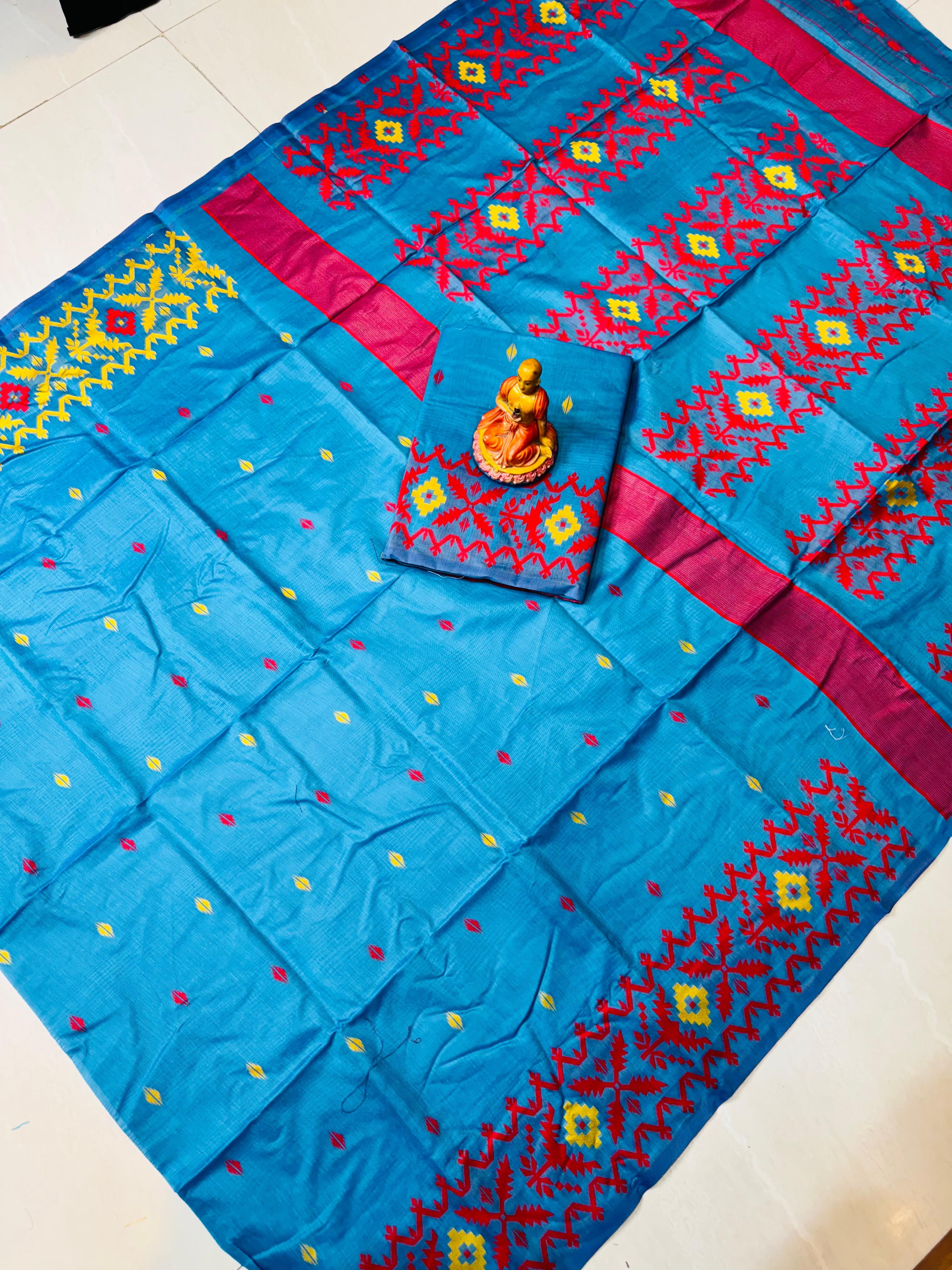 Blue embroidered fabric with colorful patterns on a white surface