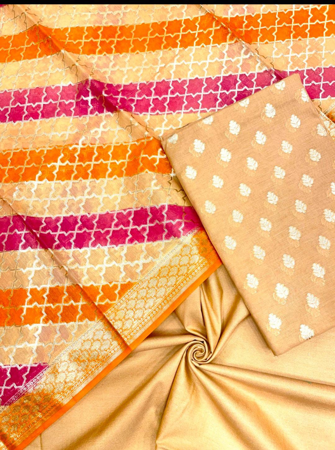 Collection of patterned fabrics with orange, pink, and beige colors.