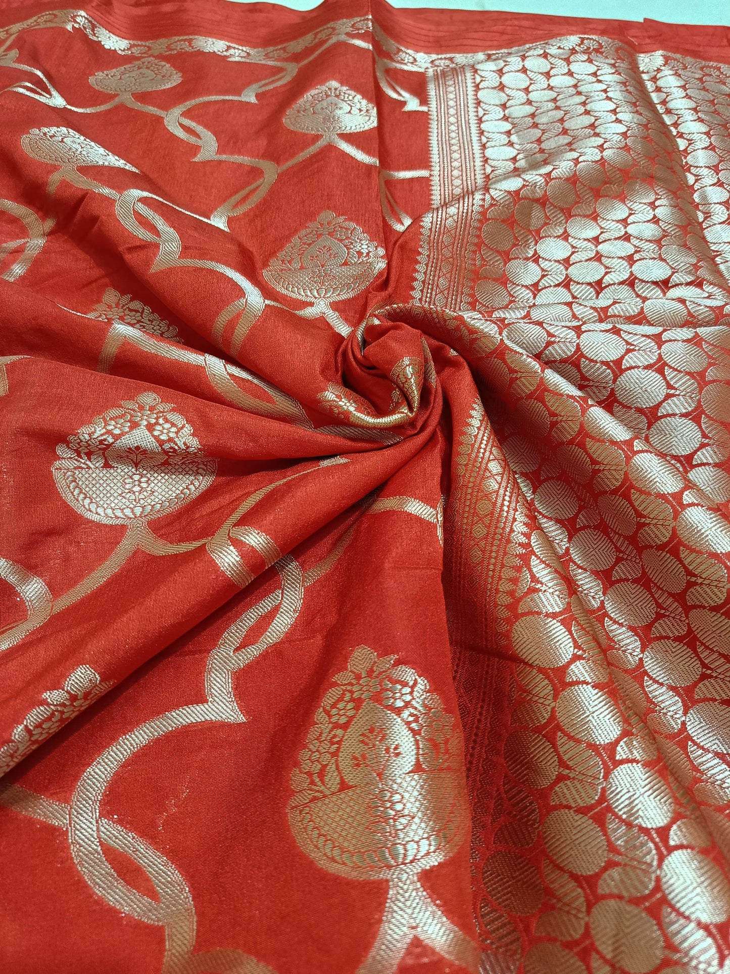 Red fabric with gold intricate patterns