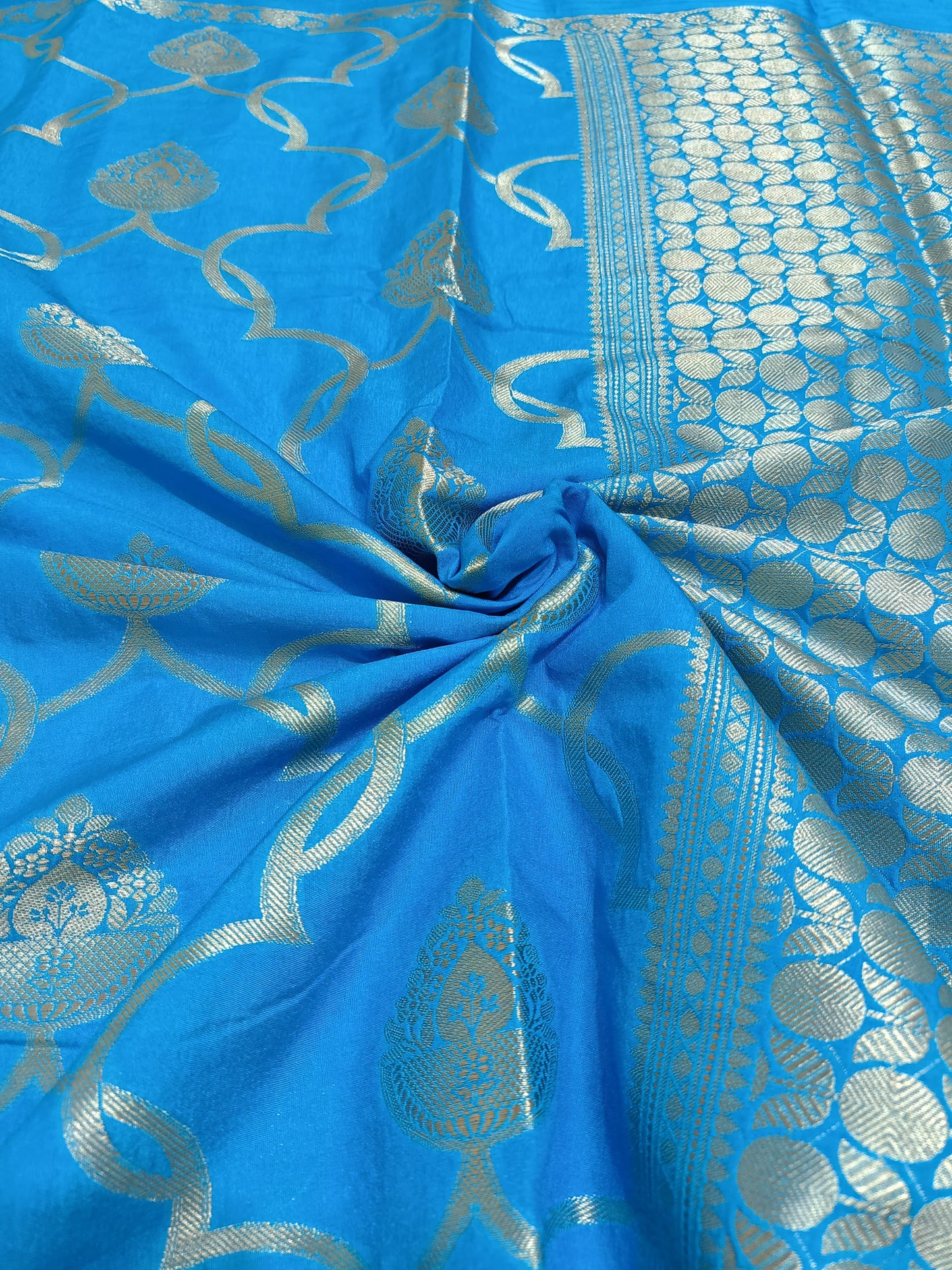 Blue fabric with silver intricate patterns