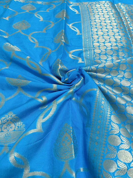 Blue fabric with silver intricate patterns