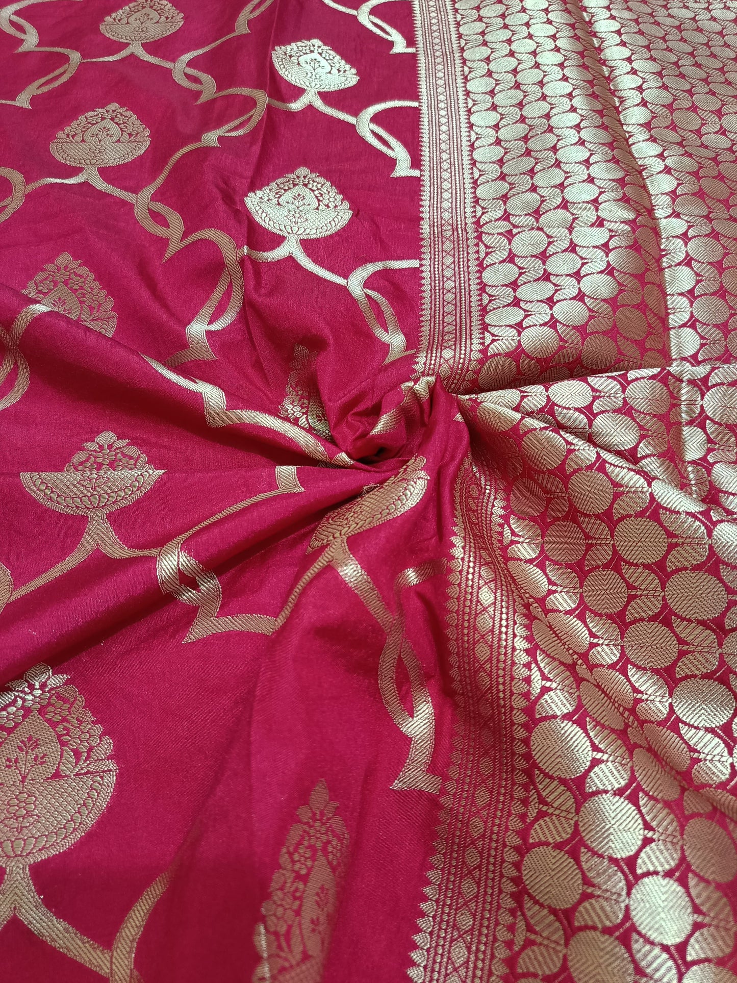 Pink saree with gold floral patterns