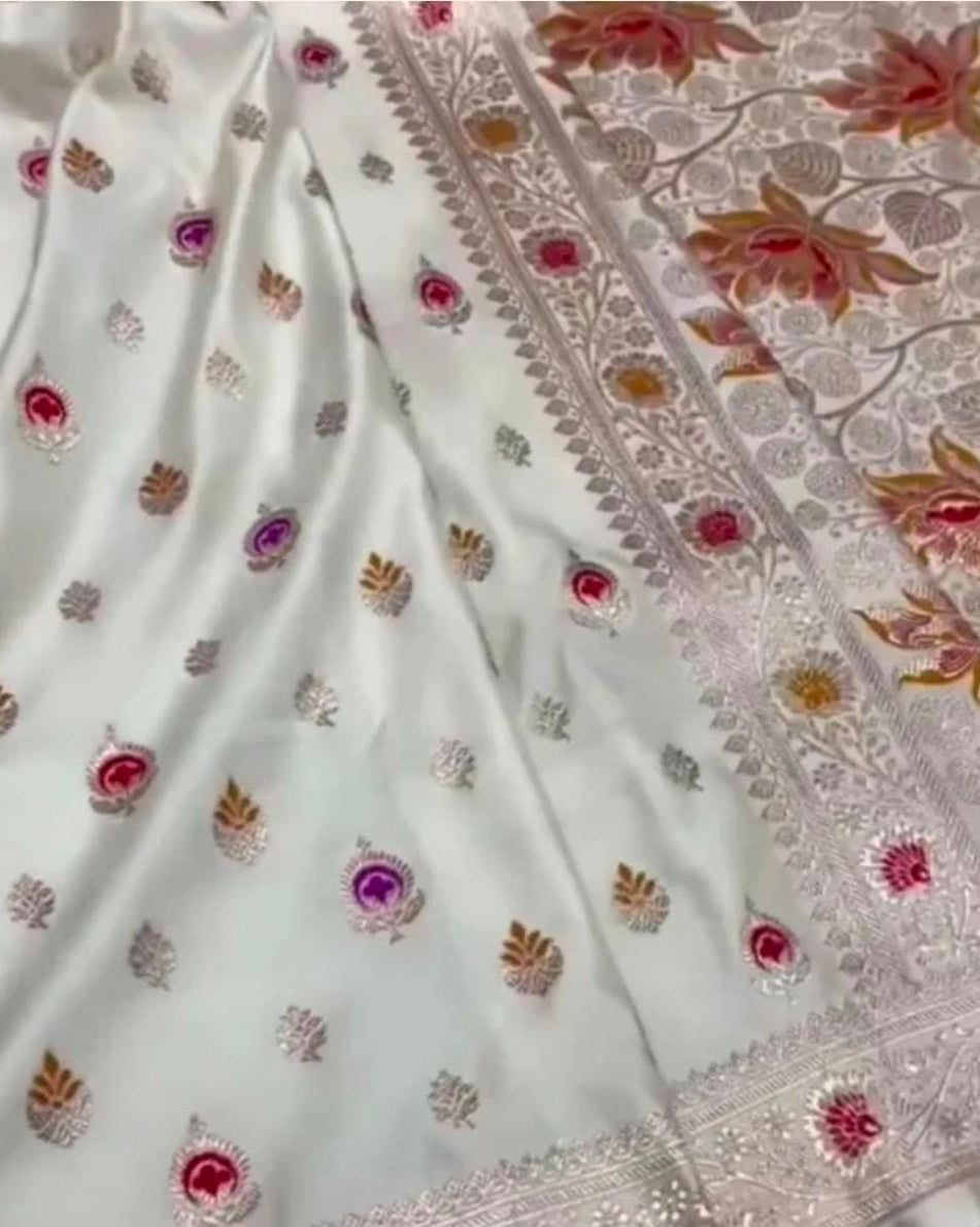 White fabric with floral embroidery and a border