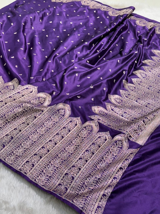 Purple fabric with silver embroidery on a white background