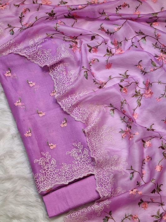 Purple fabric with floral embroidery on a white background