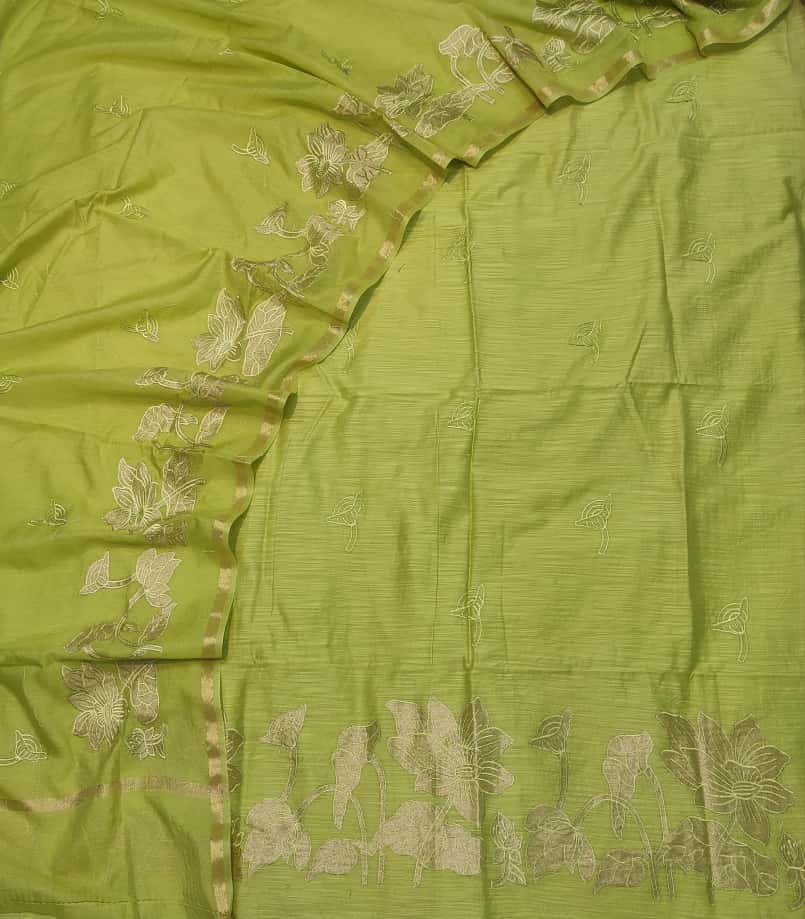Green fabric with floral embroidery