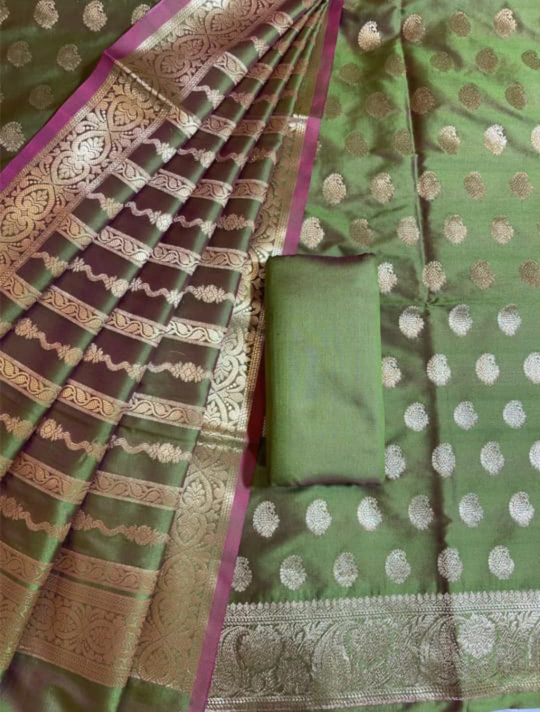 Green saree with gold and white patterns
