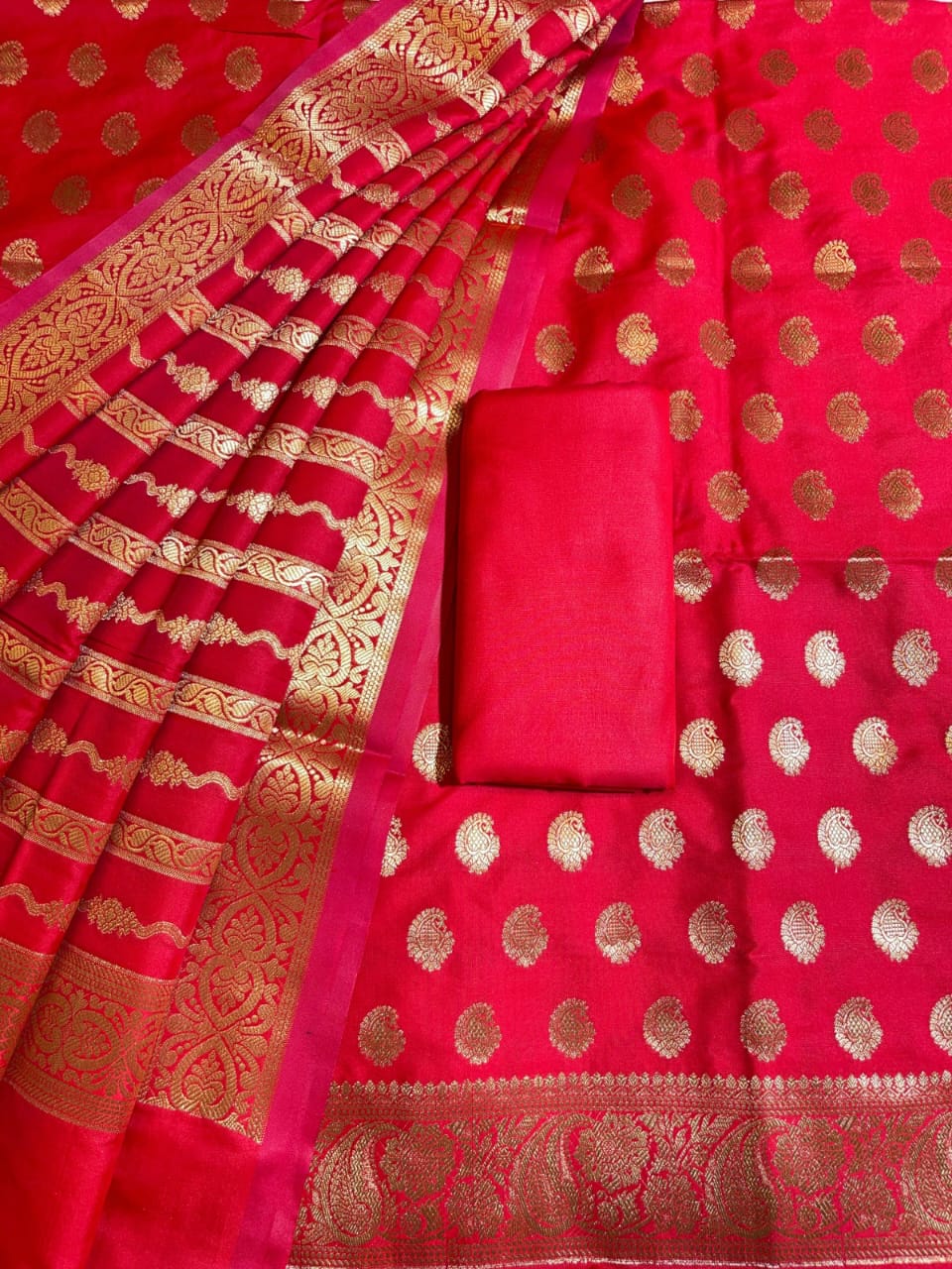 Red saree with gold patterns