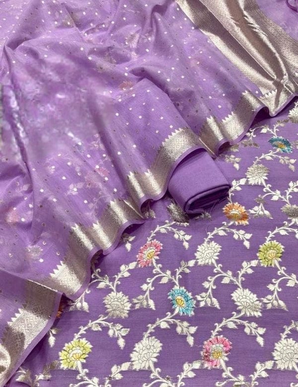 Purple saree with floral patterns and silver border
