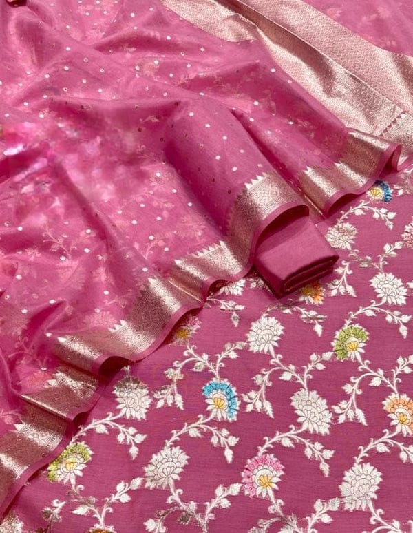 Pink fabric with floral patterns and ruffled edges