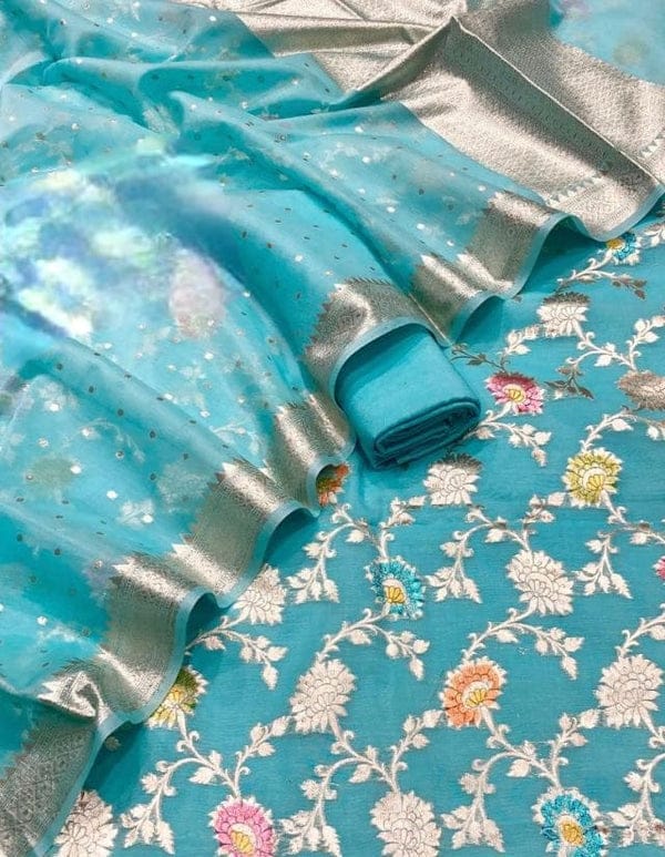 Turquoise fabric with floral patterns on a floral background