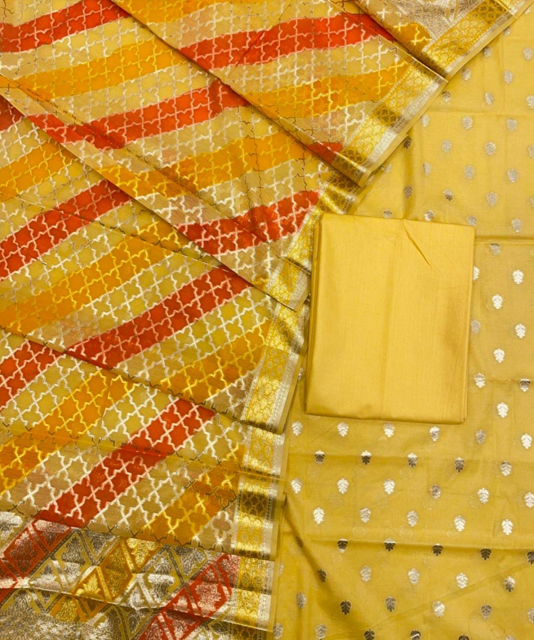 Yellow fabric with red and gold patterns