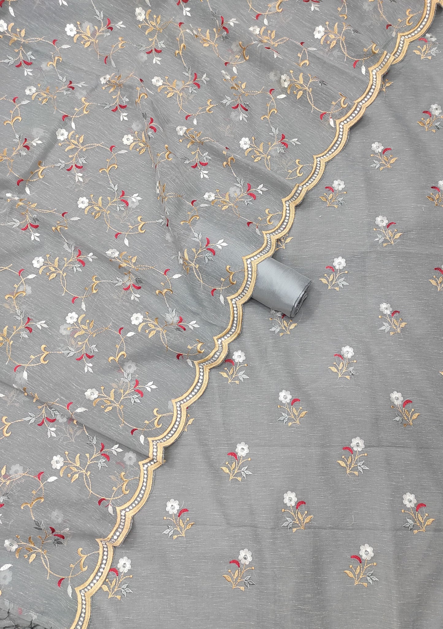 Gray fabric with floral embroidery and gold border