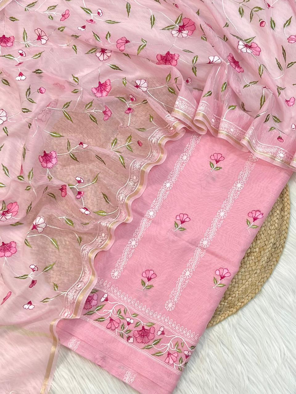 Pink saree with floral patterns on a white background