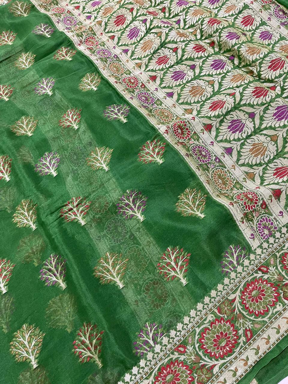 Green fabric with floral patterns on a white background