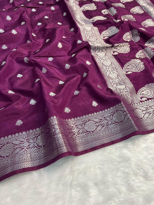 Purple fabric with silver embroidery on a white background