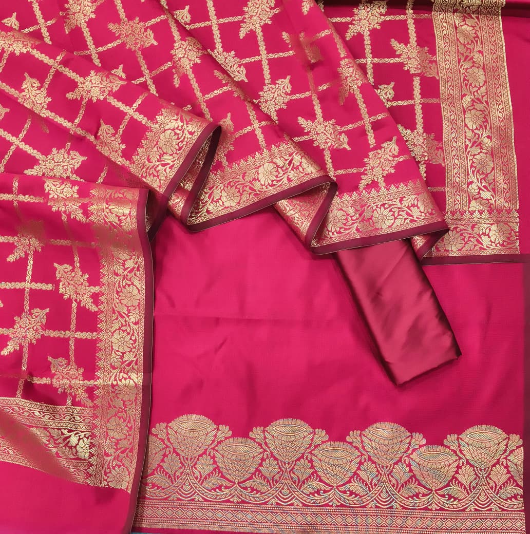 Pink saree with gold embroidery on a plain background