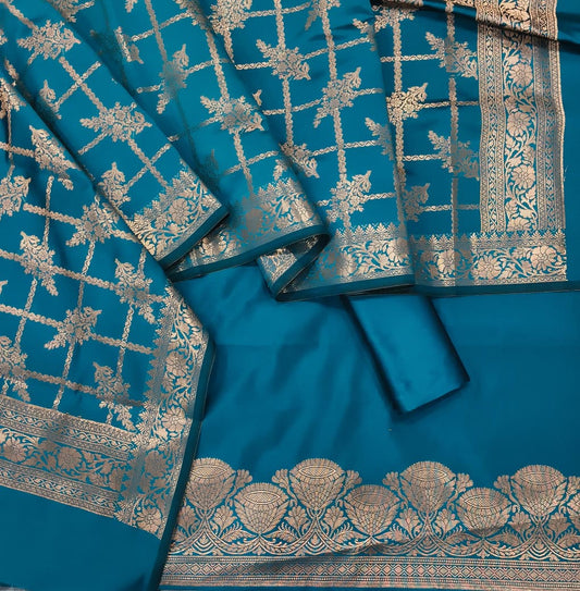 Blue saree with intricate gold patterns on a plain background