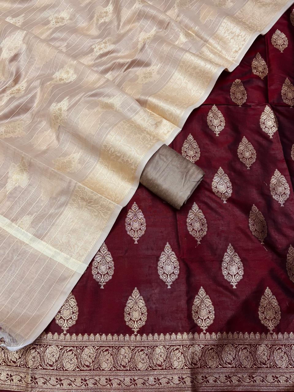 Maroon saree with gold embroidery and beige border