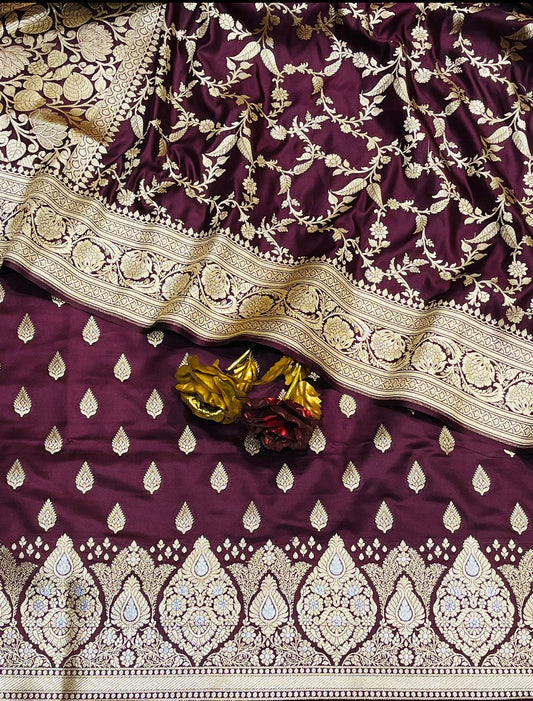 Purple fabric with gold embroidery and decorative elements