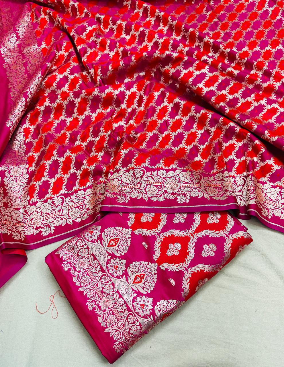 Pink and red patterned fabric on a light gray background