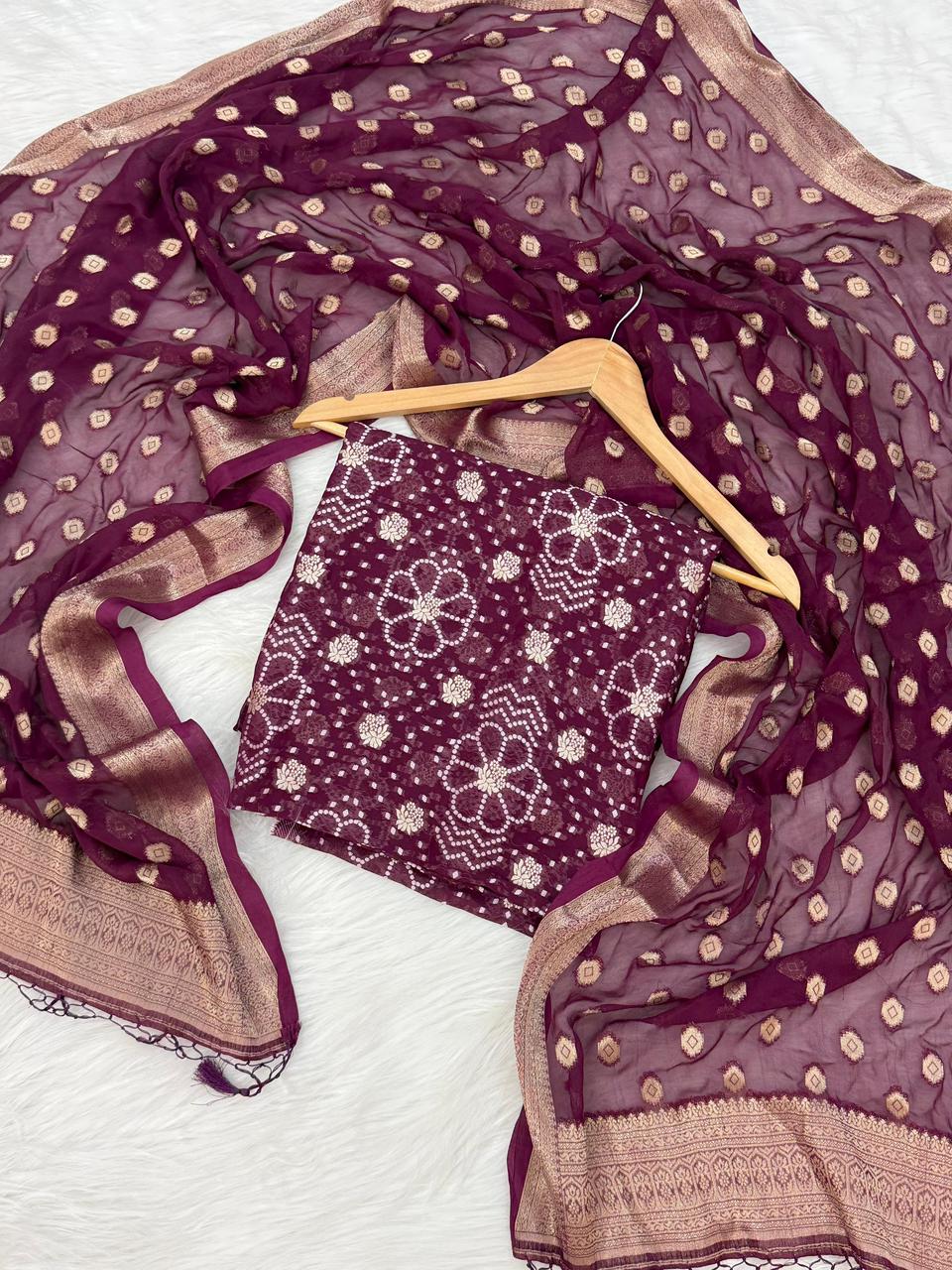 Maroon and beige traditional outfit with a hanger on a white background