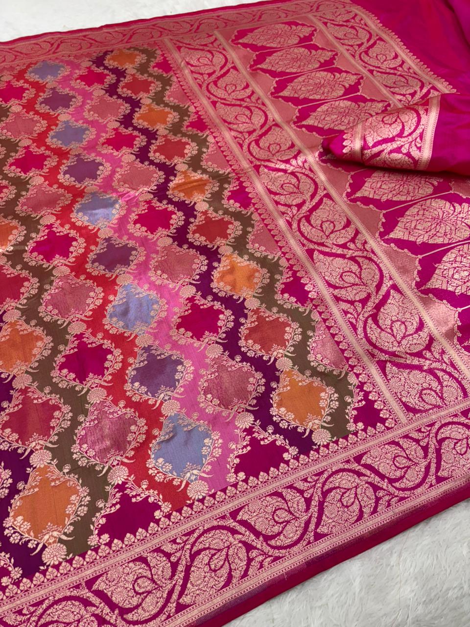 Pink and purple patterned fabric with intricate designs on a white background