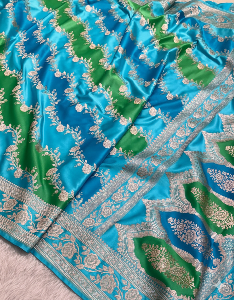 Blue and green fabric with intricate patterns on a pink background