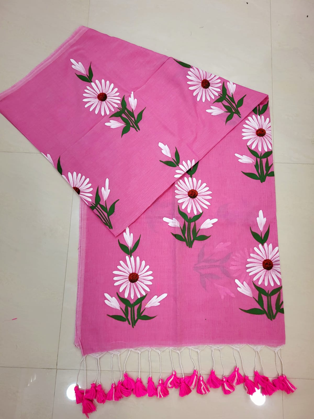 Pink scarf with floral patterns on a white background