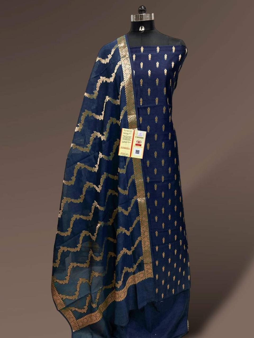 Blue patterned garment on a mannequin with a plain background