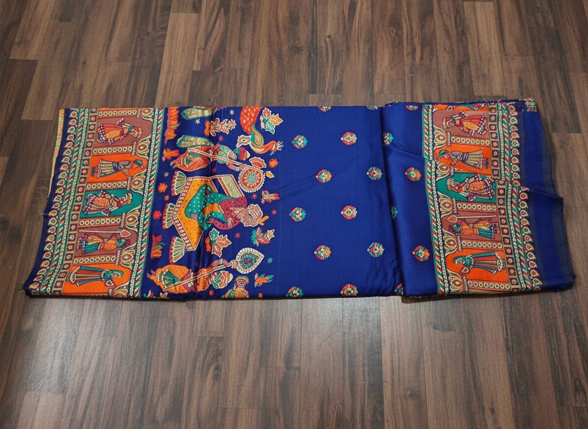Colorful fabric with intricate patterns on a wooden floor